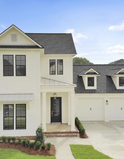 New two-story suburban home with attached garage and landscaped front yard.